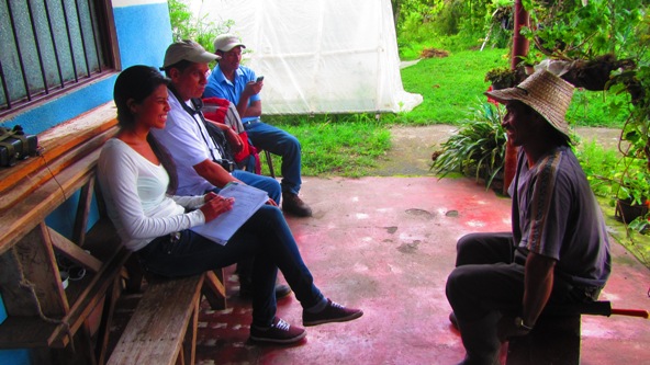 Local staff from FCC meet with Antonio and to collect information for his Kiva profile.