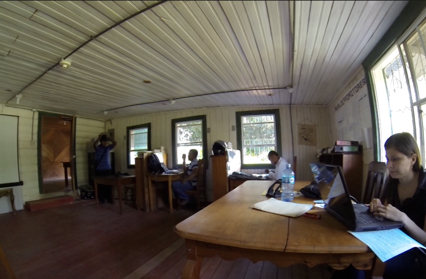 Loan officers hard at work. From left: Jairo, Wesley, Fernando and Tania, the Kiva Coordinator at Pana Pana.