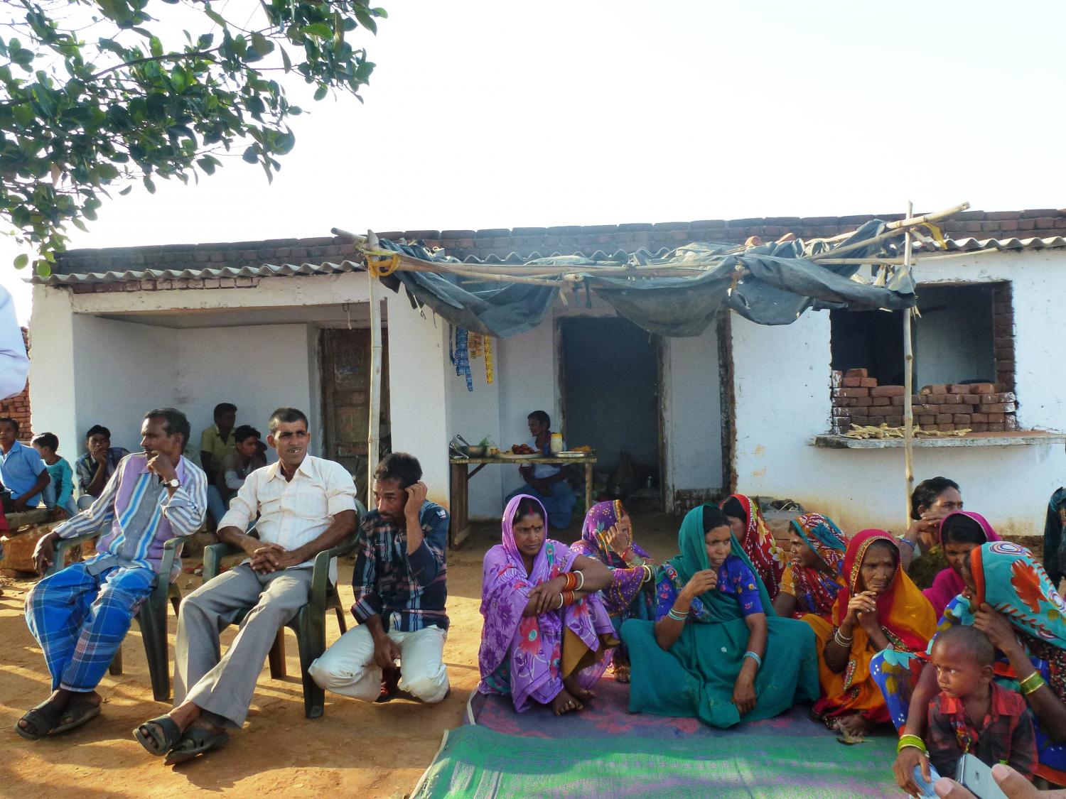 Self Help Group (SHG) meeting surrounded by curiousness