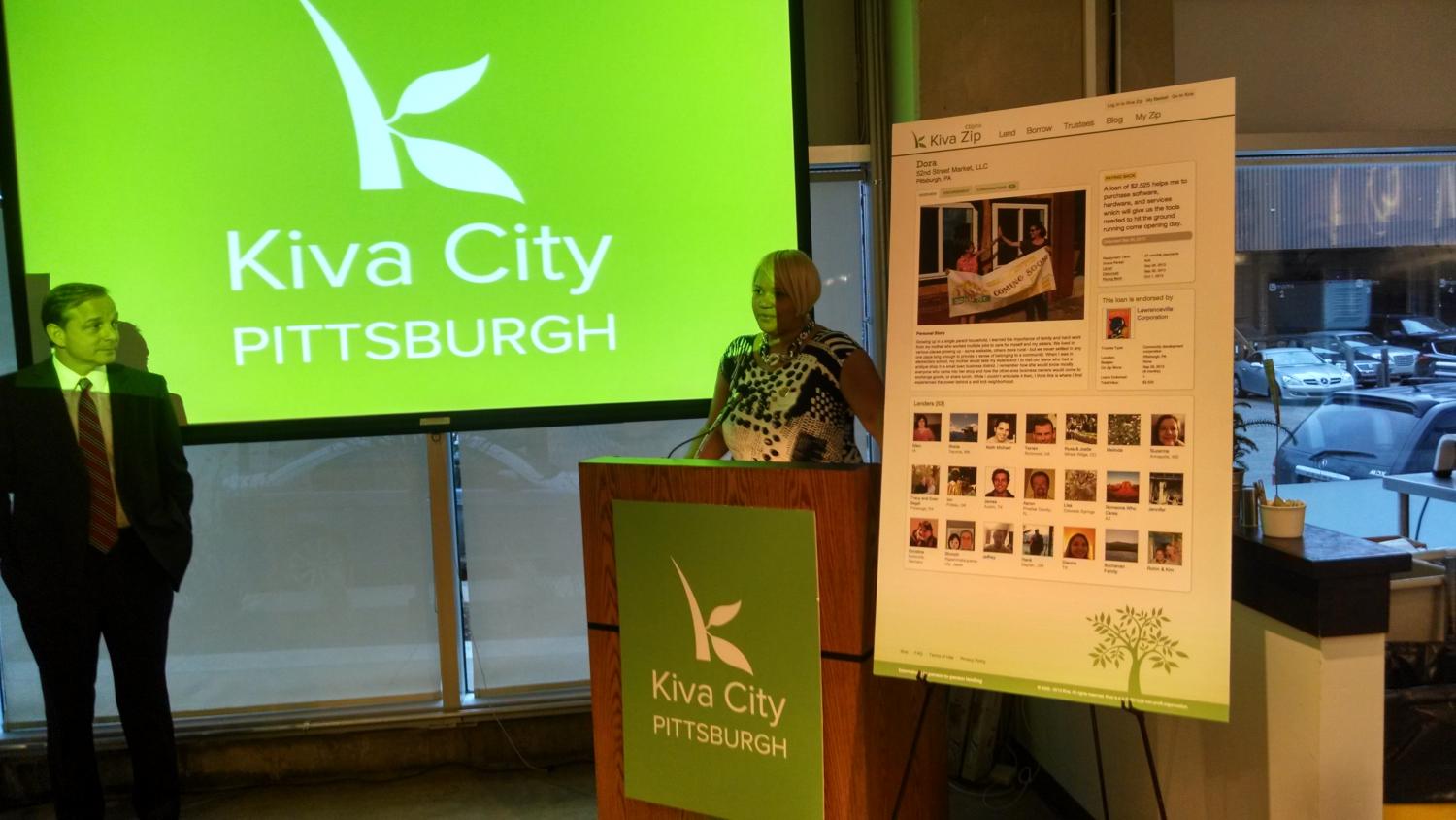 Evan Segal looks on as Tracy Carter speaks at the Kiva City Pittsburgh launch party.