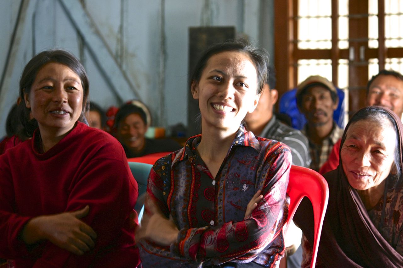 Several villagers laughing at one of Mr. Mang's jokes