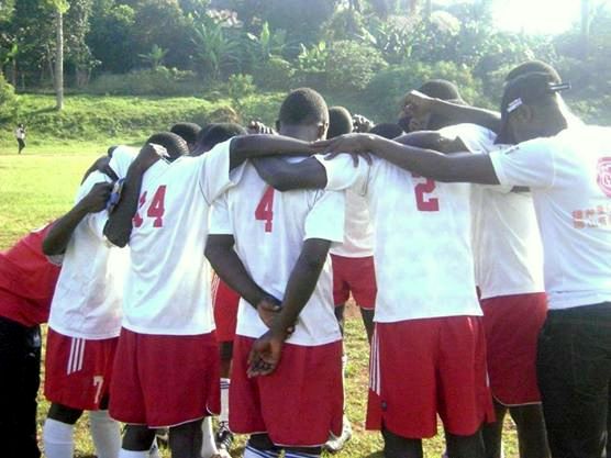 Prius's youth team huddles together before their match.