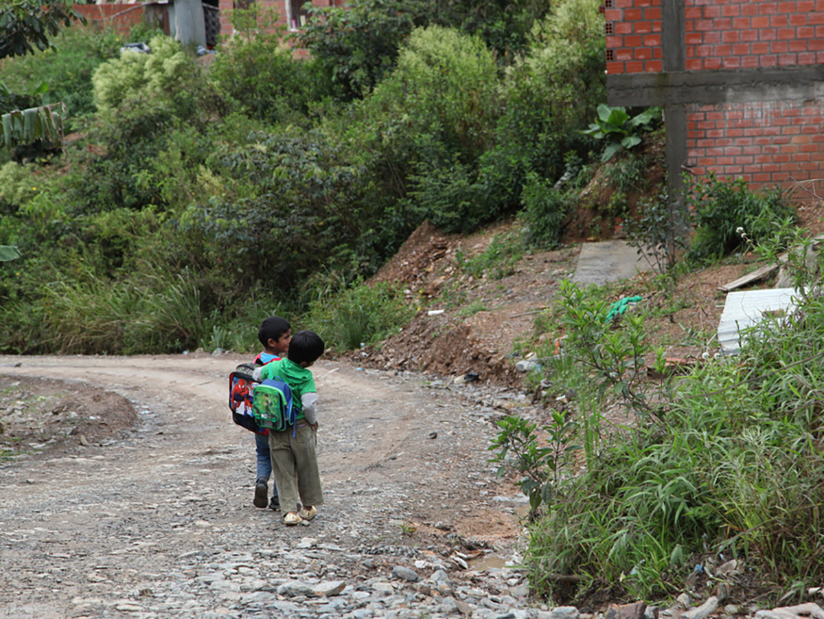 Zach Land-Miller sees two young boys walking home from school on a country road in Bolivia.
