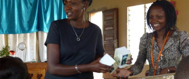 Eva passing out solar lamps