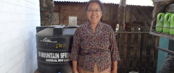 Thangkhawm and the mineral water she sells by the liter